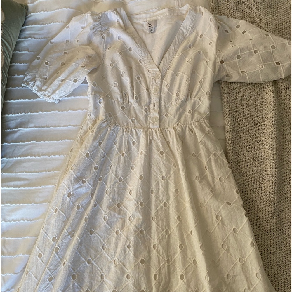white eyelet puff sleeved dress.